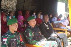 Perkuat Sinergitas TNI-Polri, Satgas Yonif 721/Mks Hadiri Peringatan HUT Bhayangkara Ke- 77